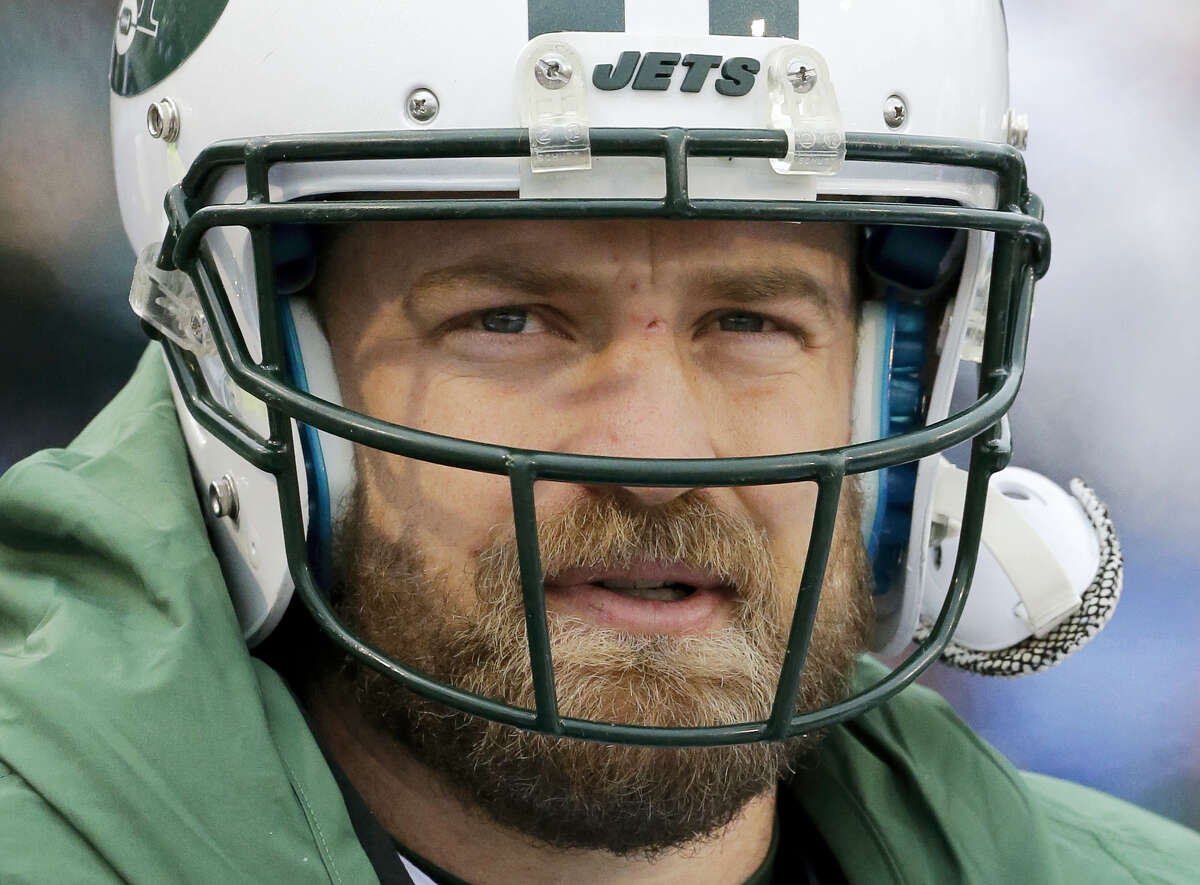 New York Jets' quarterback Ryan Fitzpatrick snaps his chin strap