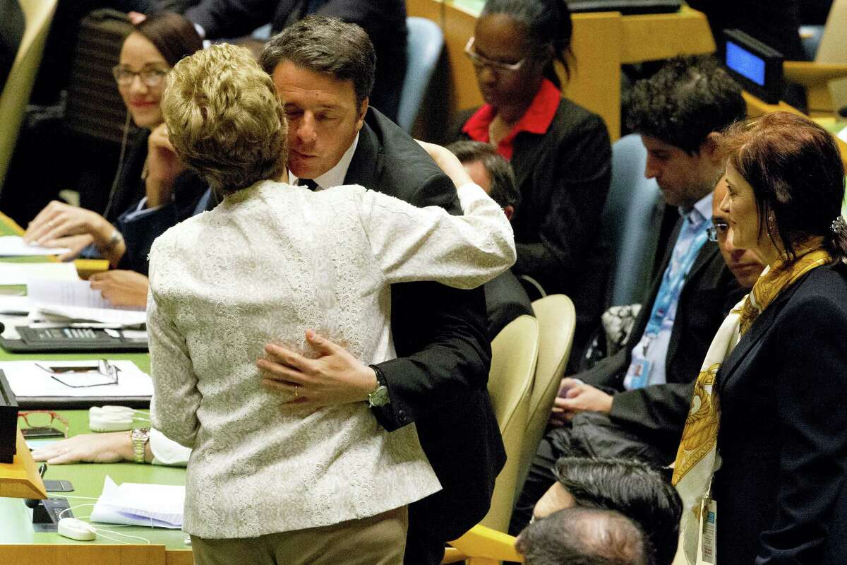 Brazilian President Dilma Rousseff greets Italian Prime Minister Matteo Renzi during the Paris Agreement on climate change ceremony, Friday, April 22, 2016 at U.N. headquarters.