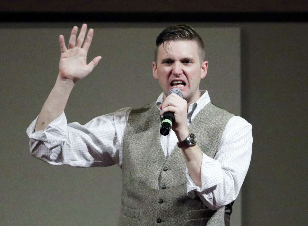 In this Dec. 6, 2016 photo, Richard Spencer, who leads a movement that mixes racism, white nationalism and populism, speaks at the Texas A&M University campus in College Station, Texas. The Montana-based National Policy Institute, run by Spencer, who popularized the term “alternative right,” is among groups of the white nationalist movement with tax-exempt status.