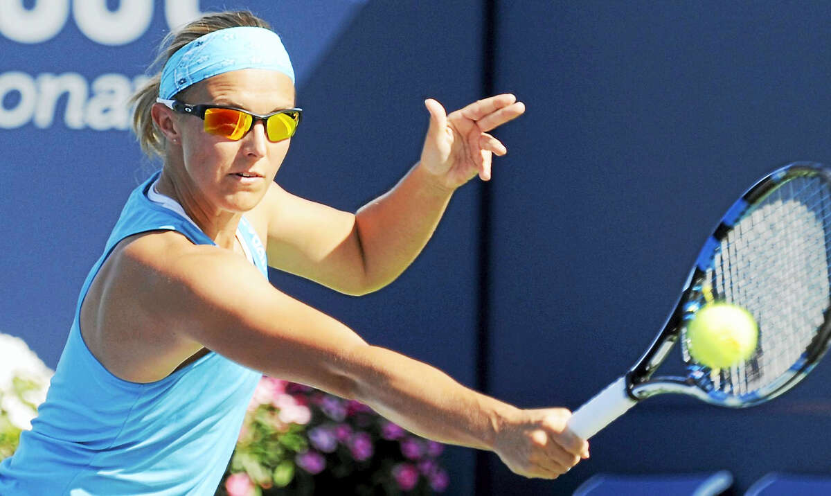 Kirsten Flipkens hits a backhand return at the Connecticut Open on Wednesday.