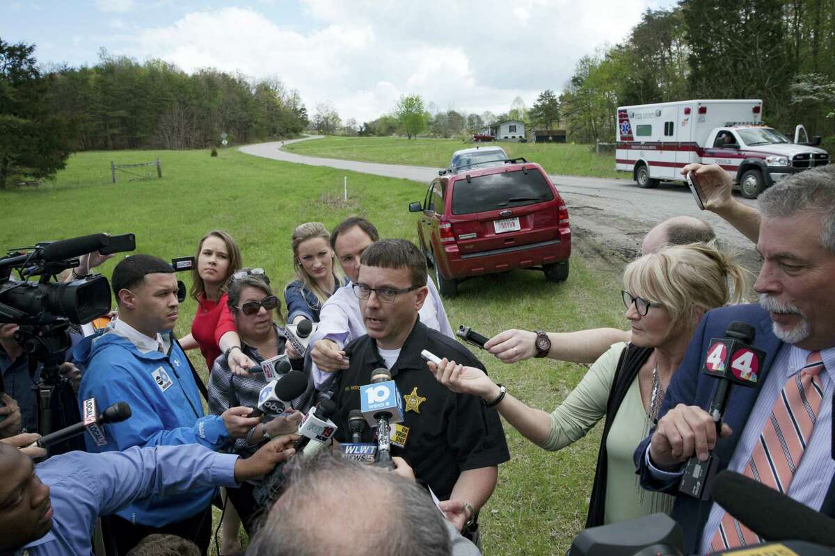 Lt. Michael Preston, of the Ross County Sheriff’s Department speaks to the media on Union Hill Road that approaches a crime scene, Friday, April 22, 2016, in Pike County, Ohio. Shootings with multiple fatalities were reported along the road in rural Ohio on Friday morning, but details on the number of deaths and the whereabouts of the suspect or suspects weren’t immediately clear. The attorney general’s office said a dozen Bureau of Criminal Investigation agents had been called to Pike County, an economically struggling area in the Appalachian region some 80 miles east of Cincinnati.
