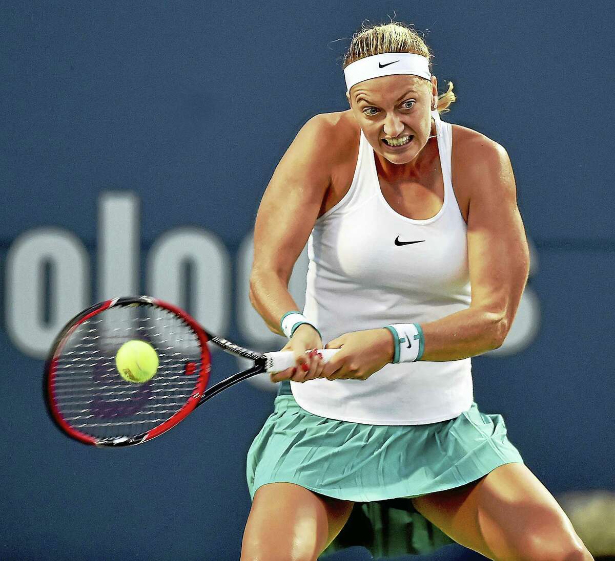 Czech Petra Kvitova hits a forehand return to Canadian Eugenie Bouchard in a 6-3, 6-2 win Wednesday evening in the second round of the Connecticut Open in New Haven.