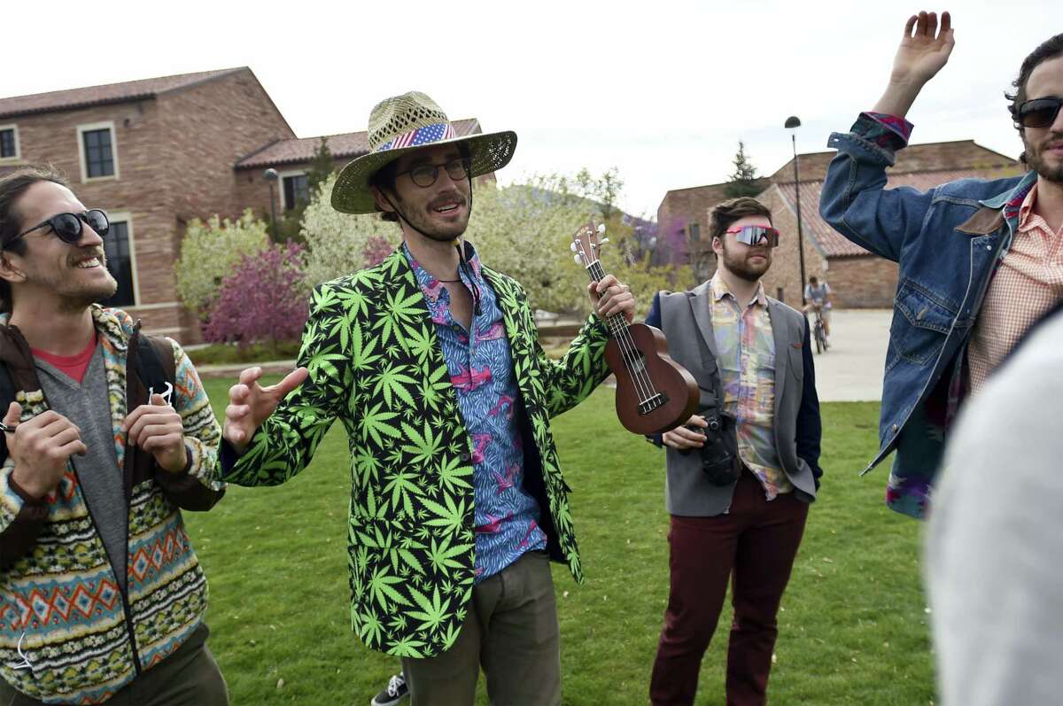 Drew Wyman talks with friends while they visited Farrand Field to see what was going on for 4/20 on the University of Colorado Boulder campus April 20, 2016 in Boulder, Colo. Public consumption remains illegal under the state’s recreational pot law, which was passed in 2012.