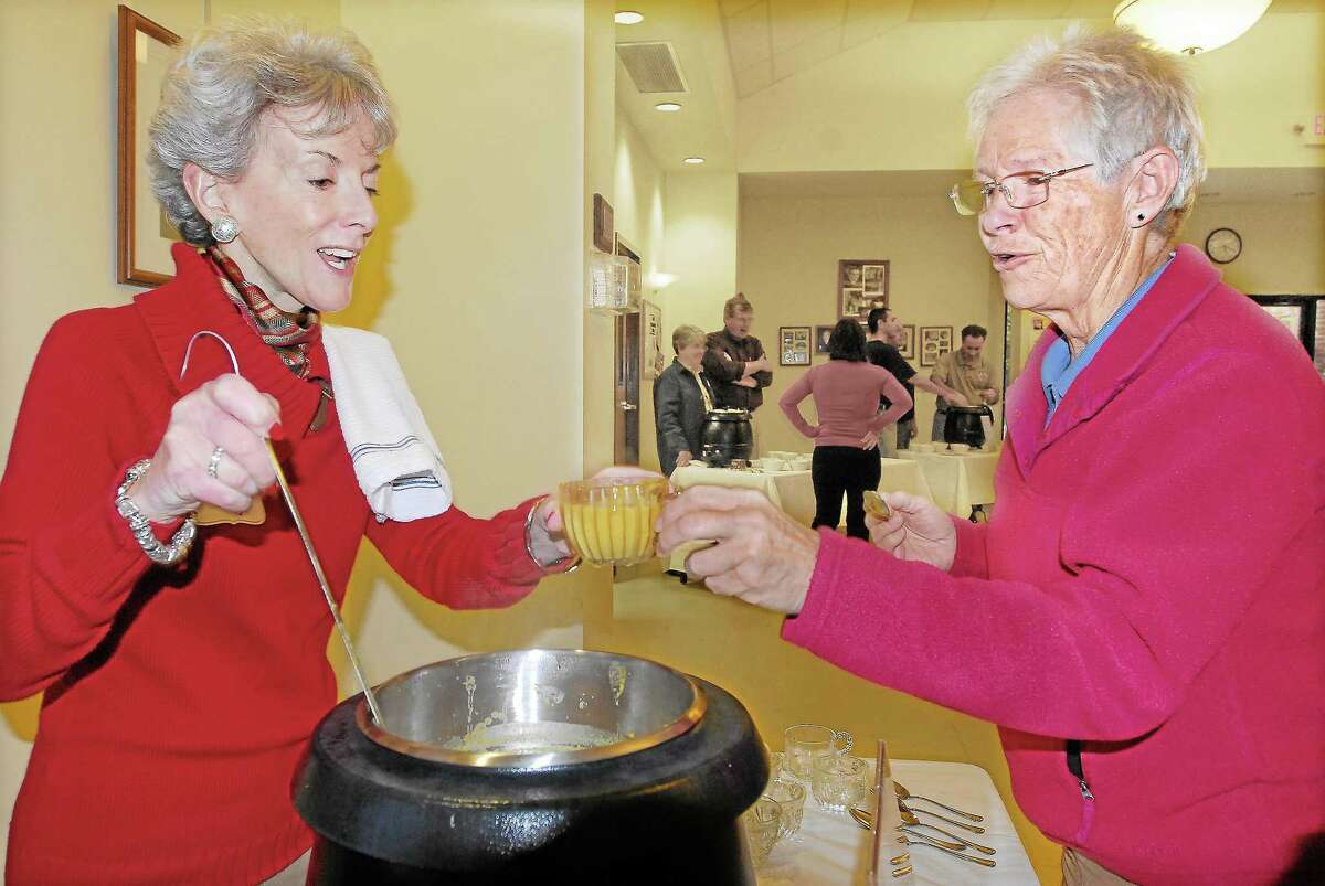 Cynthia Clegg, president and CEO of the the Community Foundation of Middlesex County, serves a cup of curried apple pumpkin soup at a recent Amazing Grace Soup Supper in Middletown.