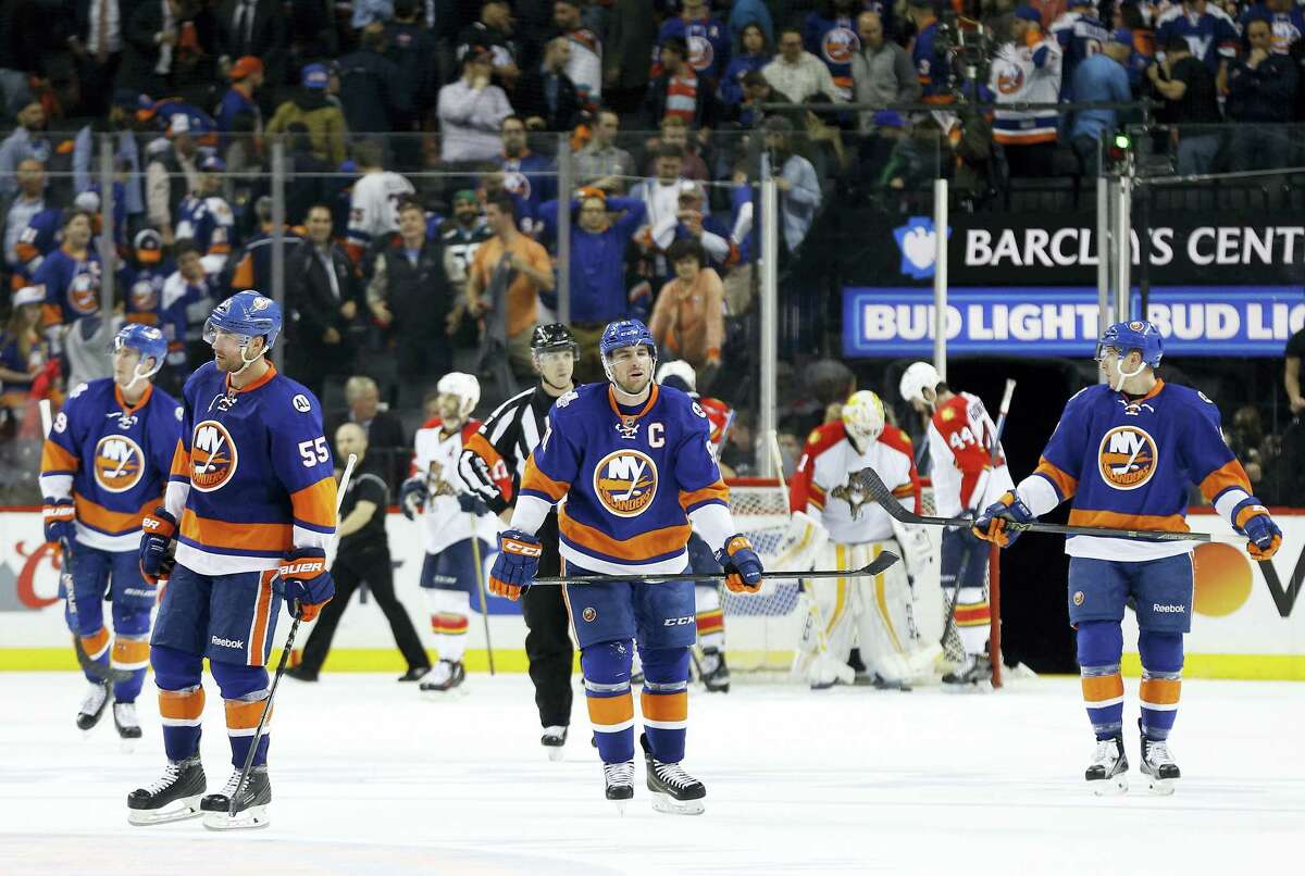 Members of the Islanders skate off the ice after losing to the Florida Panthers in Game 4 of their playoff series.