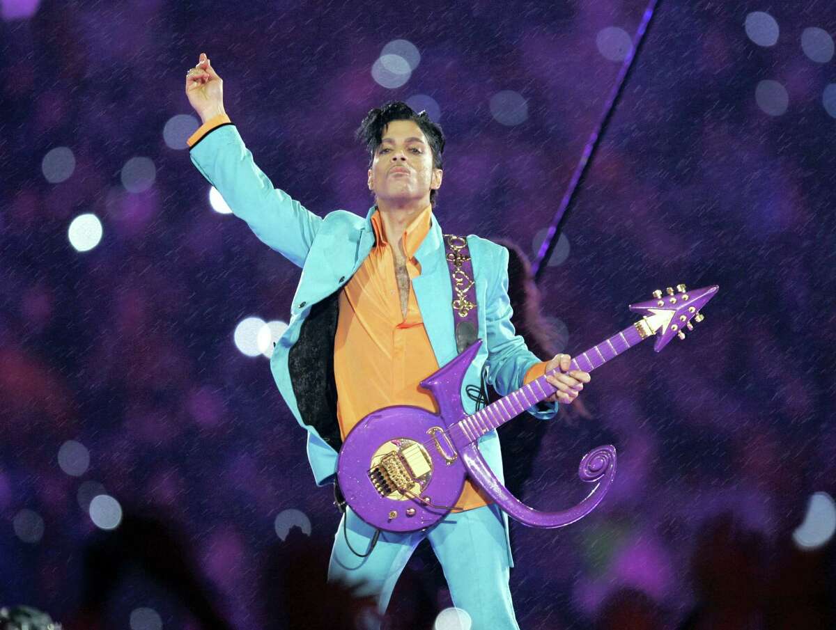 In this Feb. 4, 2007, file photo, Prince performs during the halftime show at the Super Bowl XLI football game at Dolphin Stadium in Miami. The disclosure that some pills found at Prince’s Paisley Park home and studio were counterfeit and contained the powerful synthetic opioid fentanyl strongly suggests they came to the superstar illegally. Prince died April 21, 2016, of an accidental fentanyl overdose.