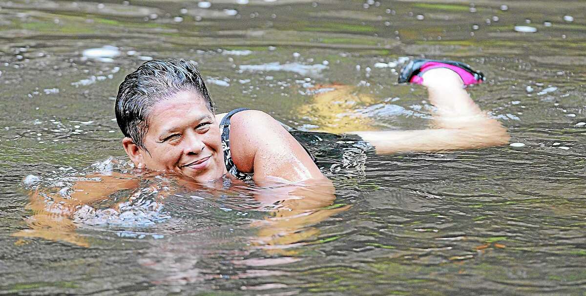 Meriden resident Lucy O’Farrill cools off at Wadsworth Falls State Park in Middlefield in this 2013 file photo.