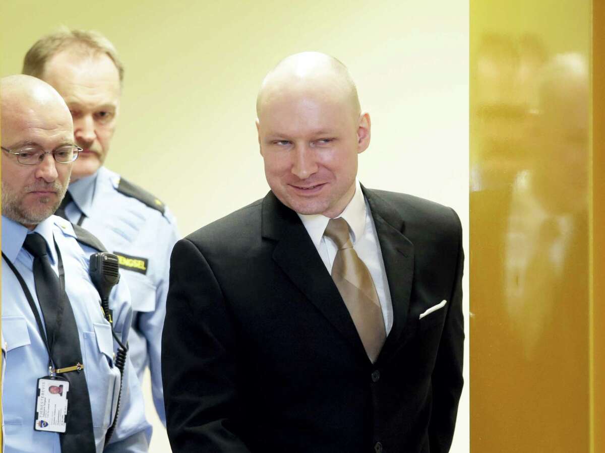 In this Tuesday, March 15, 2016, file photo of Anders Behring Breivik enters a courtroom in Skien, Norway. A court ruled on Wednesday April 20, 2016 that Breivik’s human rights have been violated during his imprisonment for terrorism and mass murder.