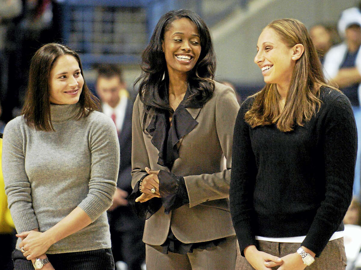 Former University of Connecticut women’s basketball players Sue Bird, left, Swin Cash, center, and Diana Taurasi, seen here in 2006 sharing a light moment during the Huskies of Honor induction ceremony at Gampel Pavillion, were named three of the WNBA’s Top 20 all-time players.
