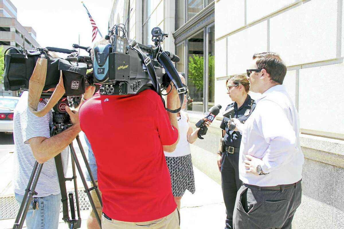 Police speak to reporters about a stabbing that took place at a home in the North End Tuesday.