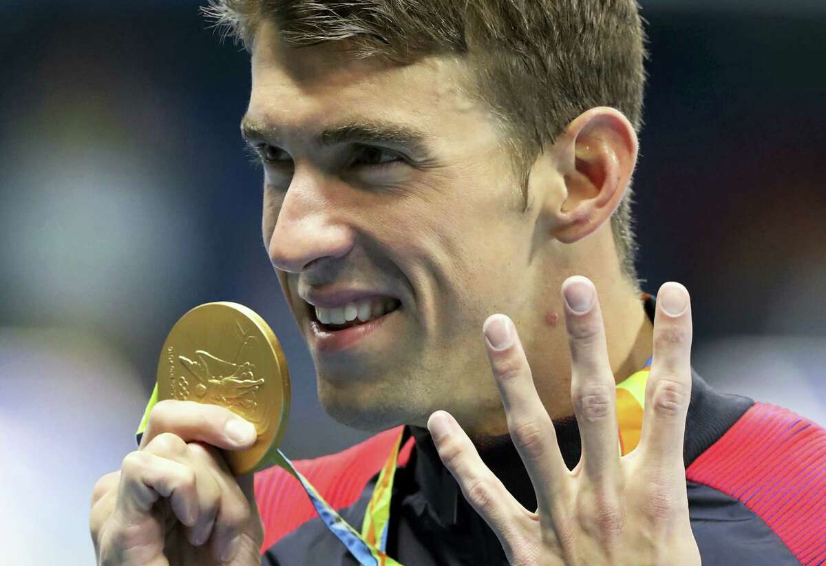 Michael Phelps celebrates winning the gold medal in the men’s 200-meter individual medley in Rio.