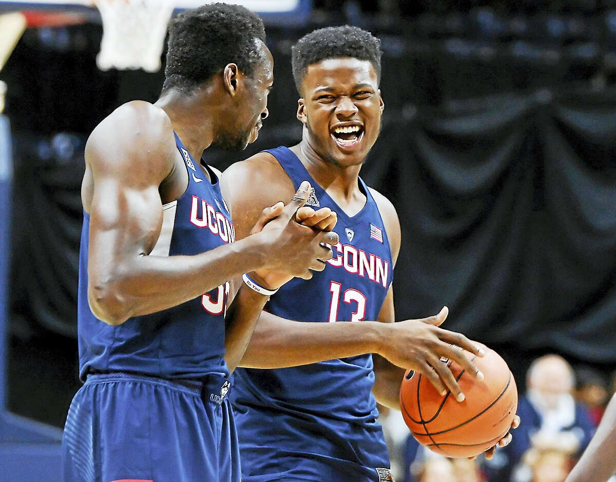 UConn’s Amida Brimah and Steve Enoch laugh during First Night in Storrs earlier this month.