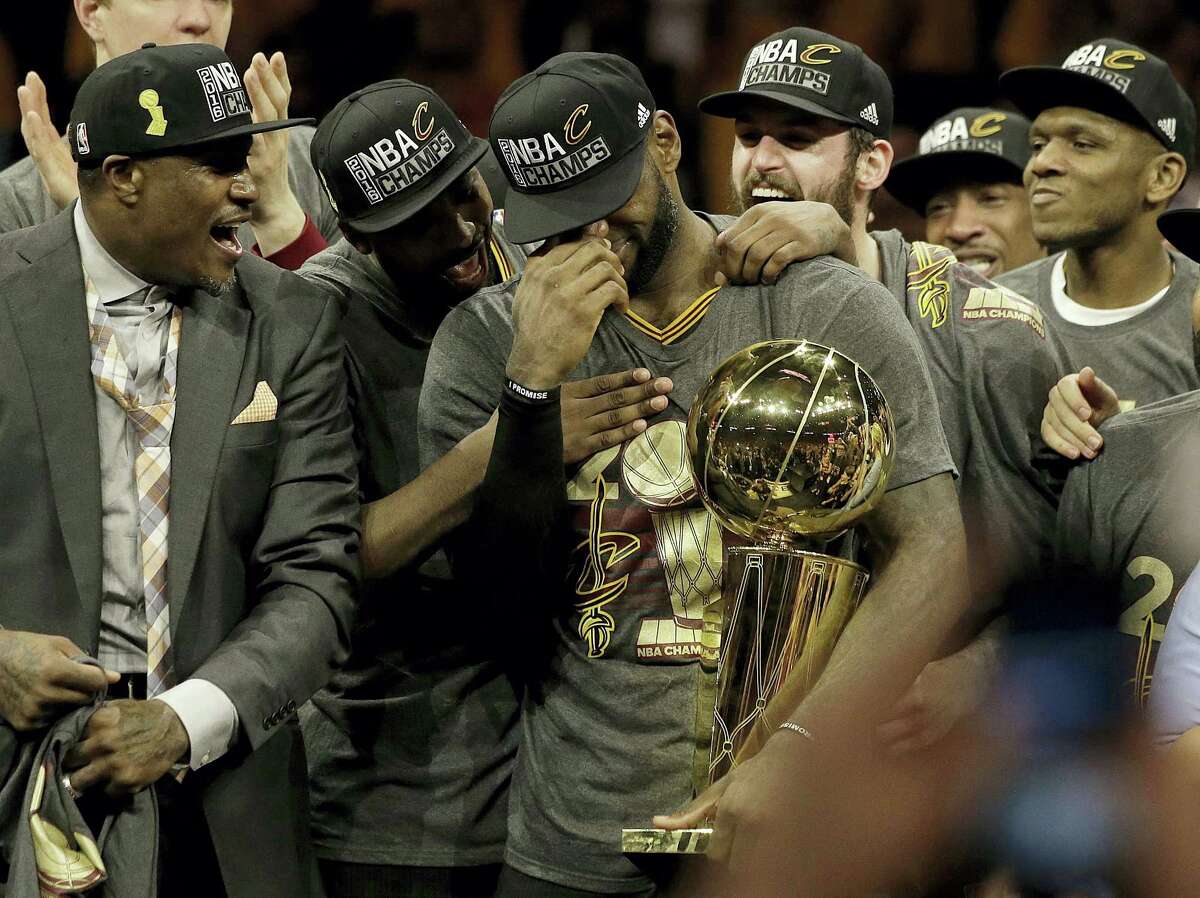 LeBron James, center, celebrates with teammates after Game 7 of of the NBA Finals on Sunday.