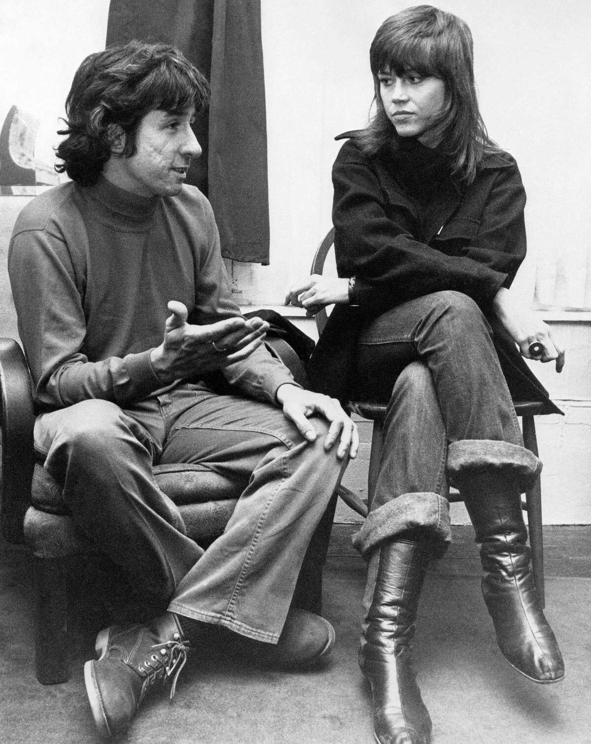 In this Dec. 26, 1972 photo, actress Jane Fonda, right, and Tom Hayden, one of the founders of SDS, talk at the home of a friend in London, after their arrival from Paris. Hayden, the famed 1960s anti-war activist who moved beyond his notoriety as a Chicago 7 defendant to become a California legislator, author and lecturer, has died at age 76. His wife, Barbara Williams, says Hayden died on Oct. 23, 2016, in Santa Monica of a long illness.