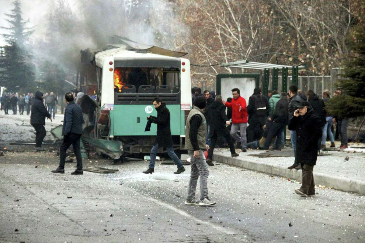 A public bus is burning at the scene of a car bomb attack in central Anatolian city of Kayseri, Turkey, Saturday, Dec. 17, 2016. A public bus was heavily damaged and dear and injured were reported. Turkish authorities have banned distribution of images relating to the Istanbul explosions within Turkey.