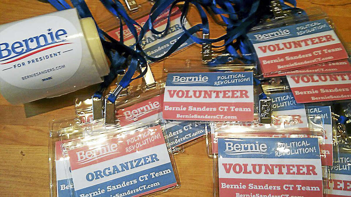 Identification tags and stickers were distributed to volunteers prior to a march for Bernie Sanders recently in Hartford.