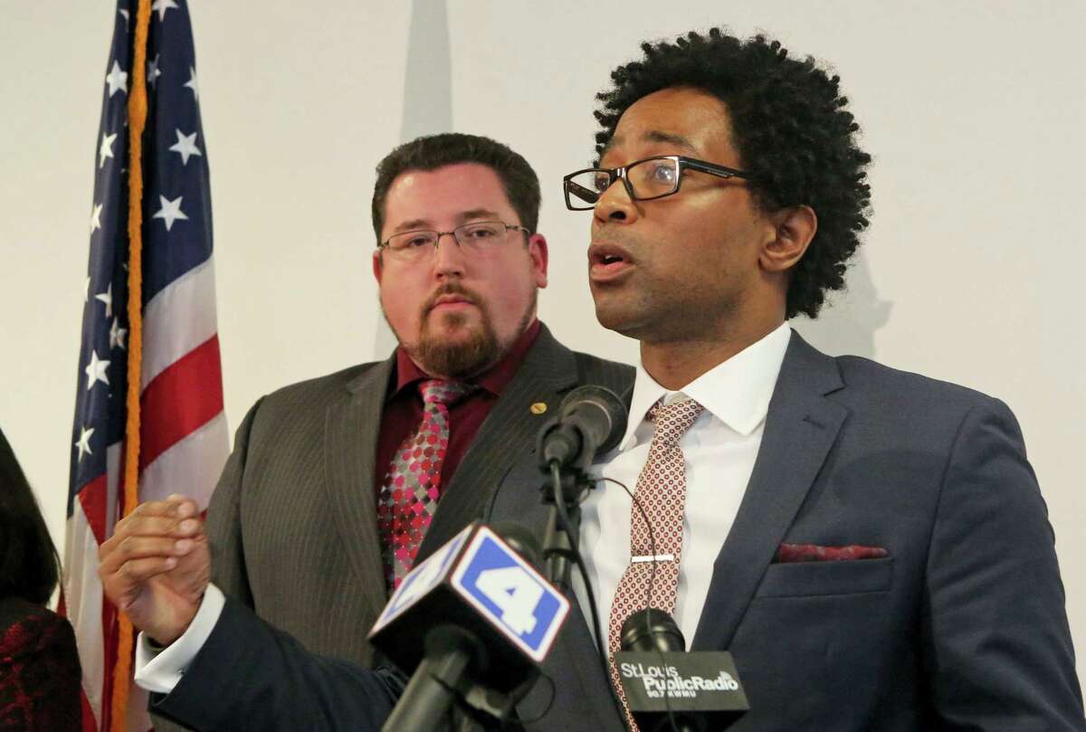Ferguson City Councilman Wesley Bell explains the revisions and the unanimous vote in favor of the DOJ agreement at a press conference on Wednesday, Feb. 10, 2016, at the City of Ferguson Community Center. Behind him is Mayor James Knowles.