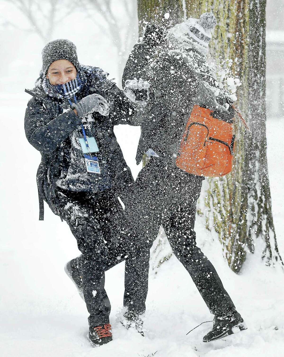Victor Batista, left, and Joan Gomez have a snowball fight on Yale University’s Cross Campus in New Haven in January.