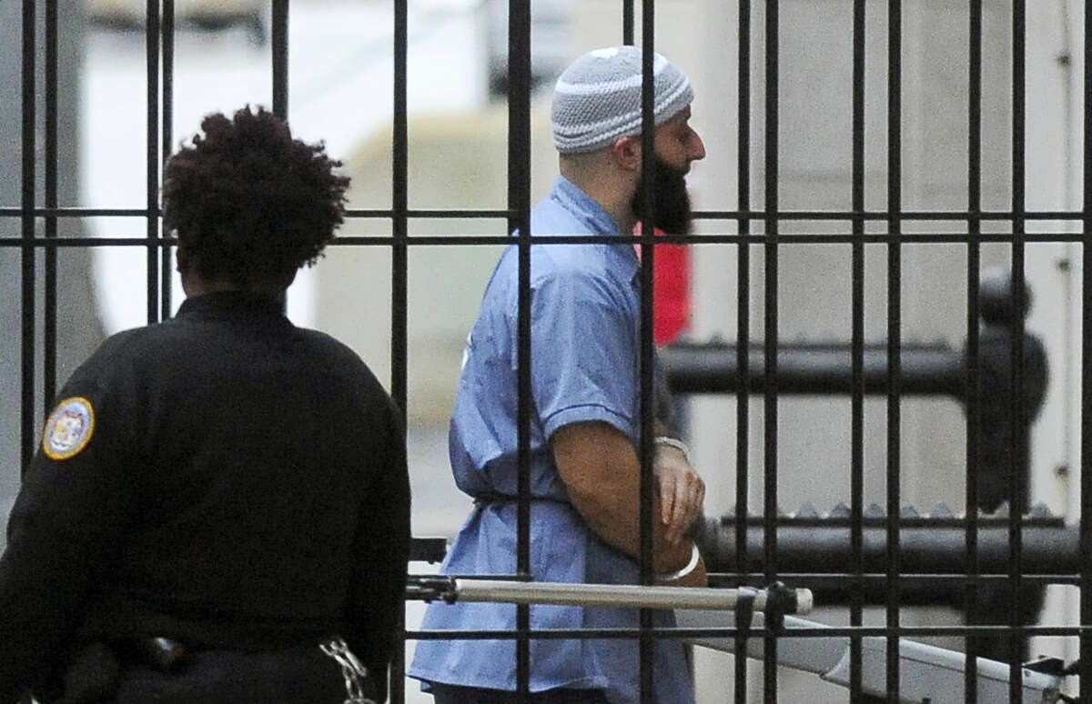 FILE - In this Feb. 3, 2016 file photo, Adnan Syed enters Courthouse East in Baltimore prior to a hearing in Baltimore. An alibi witness who was never called, cell phone data that was misrepresented and other legal failures more than justify a new trial for Syed, his defense lawyer argued Tuesday, Feb. 9, 2016 closing an unusual hearing prompted by the popular "Serial" podcast's extensive re-examination of the murder case. (Barbara Haddock Taylor/The Baltimore Sun via AP) WASHINGTON EXAMINER OUT; MANDATORY CREDIT