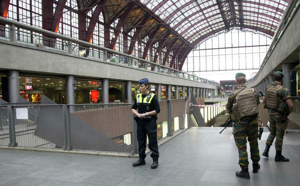 Police and Belgian Army soldiers guard a cordon at Antwerp Central train station in Antwerp, Belgium on Saturday, June 18, 2016. Police and the bomb squad unit responded to a suspect package in the Antwerp station while the Belgian federal prosecutor’s office said early Saturday that homes and car ports were searched in 16 municipalities, mostly in and around Brussels in an anti-terror sweep.