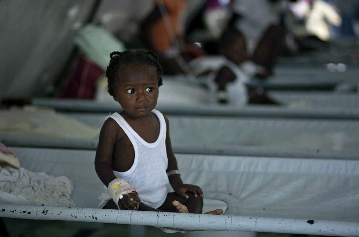 A girl receives treatment for cholera symptoms at a Doctors Without Borders, MSF, cholera clinic in Port-au-Prince, Haiti.