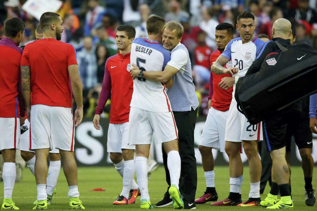 United States coach Jurgen Klinsmann, center. embraces Matt Besler at the end Thursday’s win over Ecuador in the Copa America quarterfinals.