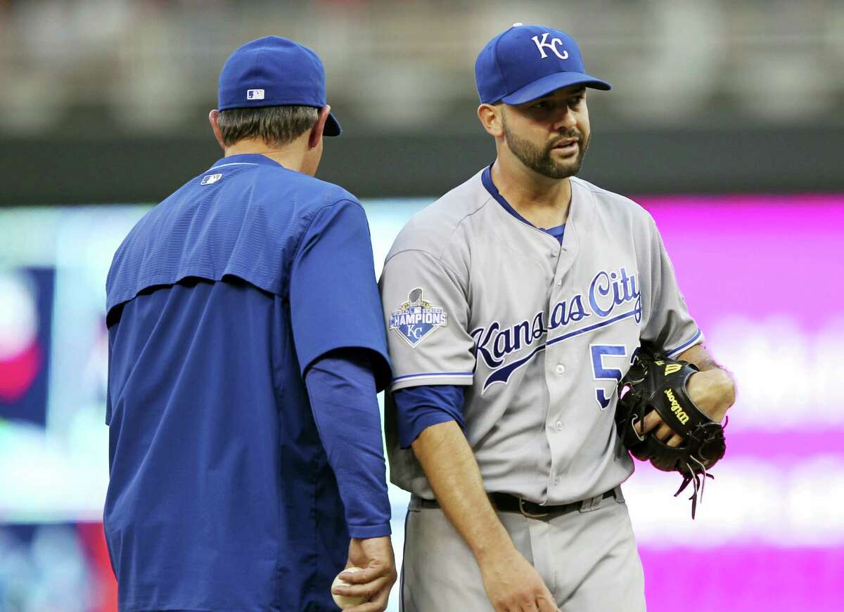 Kansas City Royals manager Ned Yost takes the ball from starting pitcher Dillon Gee during a recent game.