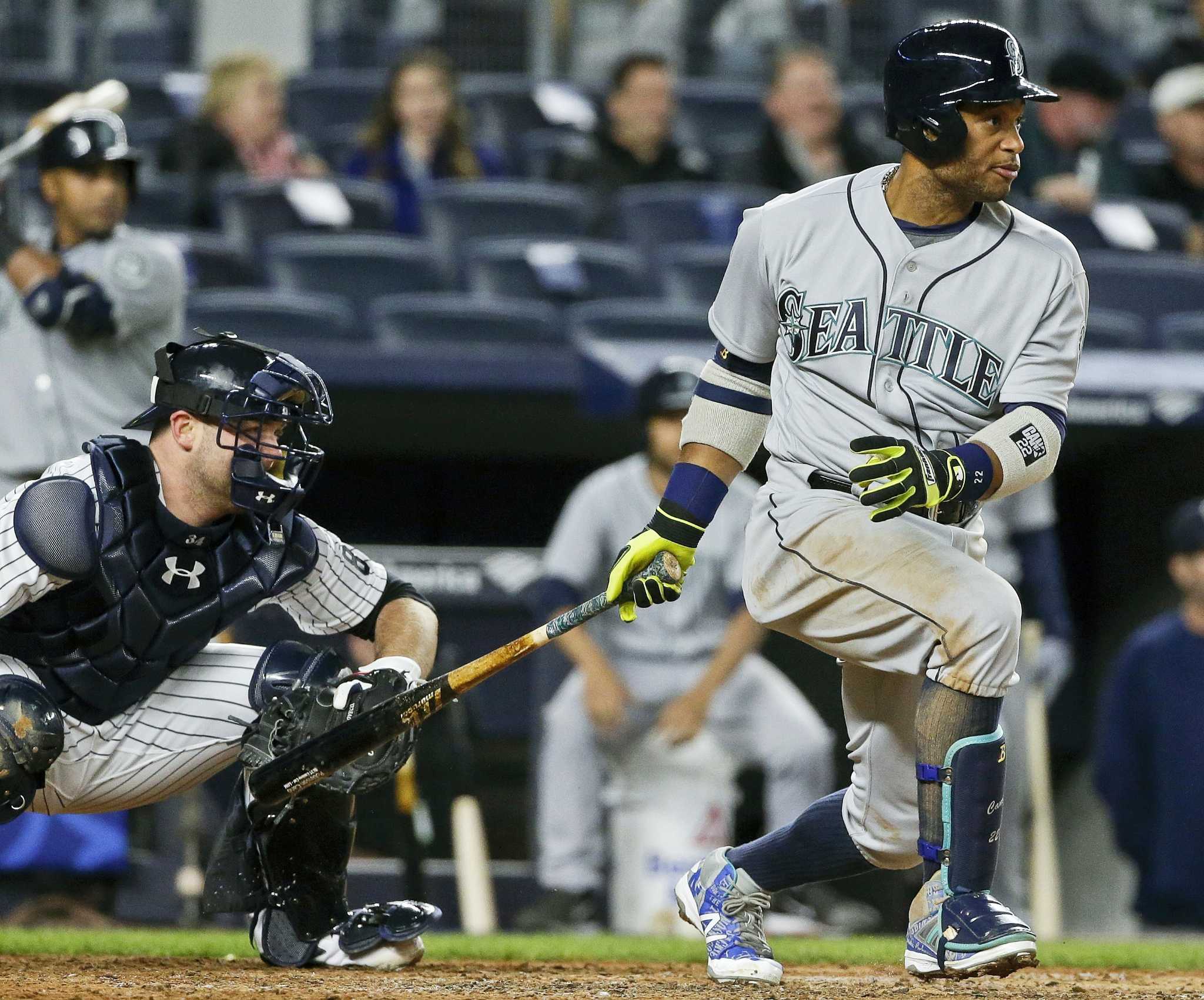 Robinson Cano of the New York Yankees takes to the field during a