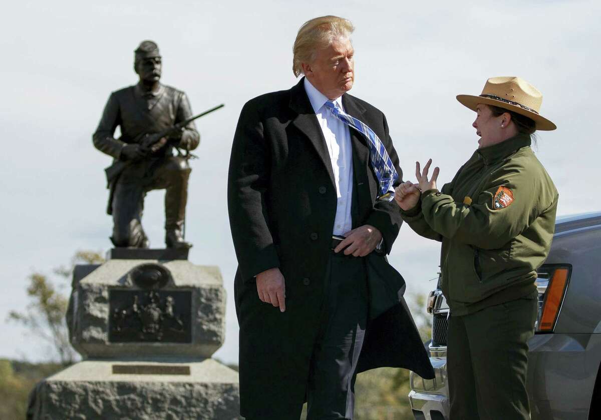 Interpretive park ranger Caitlin Kostic speaks to Republican presidential candidate Donald Trump as she gives him a tour at Gettysburg National Military Park Saturday, Oct. 22, 2016, in Gettysburg, Pa.