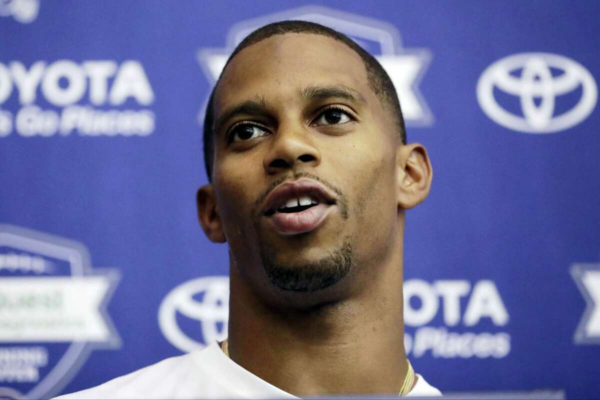 FILE - In this July 29, 2016, file photo, New York Giants wide receiver Victor Cruz talks to reporters during NFL football training camp in East Rutherford, N.J. The oft-injured Cruz isn't giving up on his hope to play for the Giants. The 29-year-old wide receiver remained optimistic Wednesday, Aug. 17, 2016, despite being sidelined the past few days by a groin injury. (AP Photo/Julio Cortez, File)