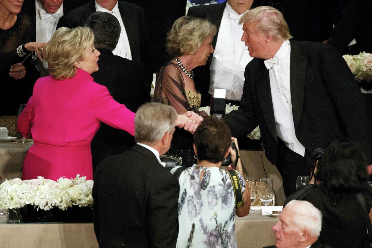 Republican presidential candidate Donald Trump, right, shakes hands with Democratic presidential candidate Hillary Clinton during the Alfred E. Smith Memorial Foundation dinner, Thursday, Oct. 20, 2016, in New York.