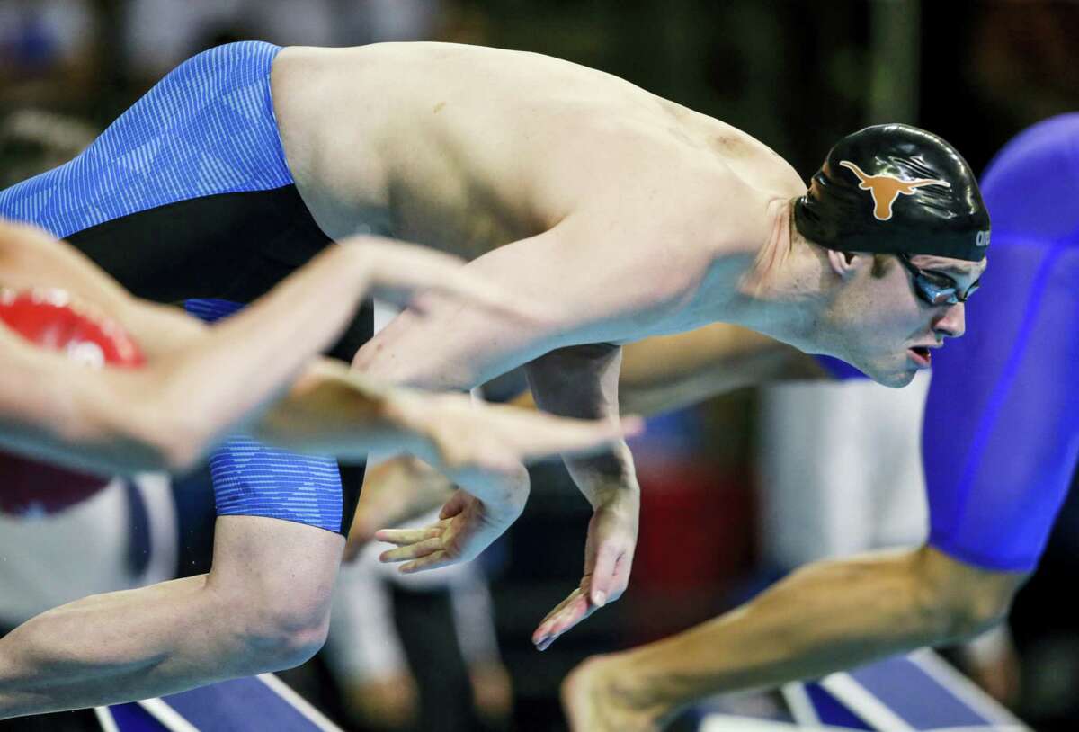 Jack Conger dives at the start of his heat in the men’s 100-meter butterfly semifinals at the U.S. Olympic swimming trials in Omaha, Neb. The U.S. Olympic Committee said on Wednesday, Aug. 17, 2016 that two American swimmers were taken off their flight from Brazil by local authorities amid an investigation into a reported robbery involving Ryan Lochte and his teammates. USOC spokesman Patrick Sandusky said that “Jack Conger and Gunnar Bentz were removed from their flight to the United States by Brazilian authorities. We are gathering further information.”