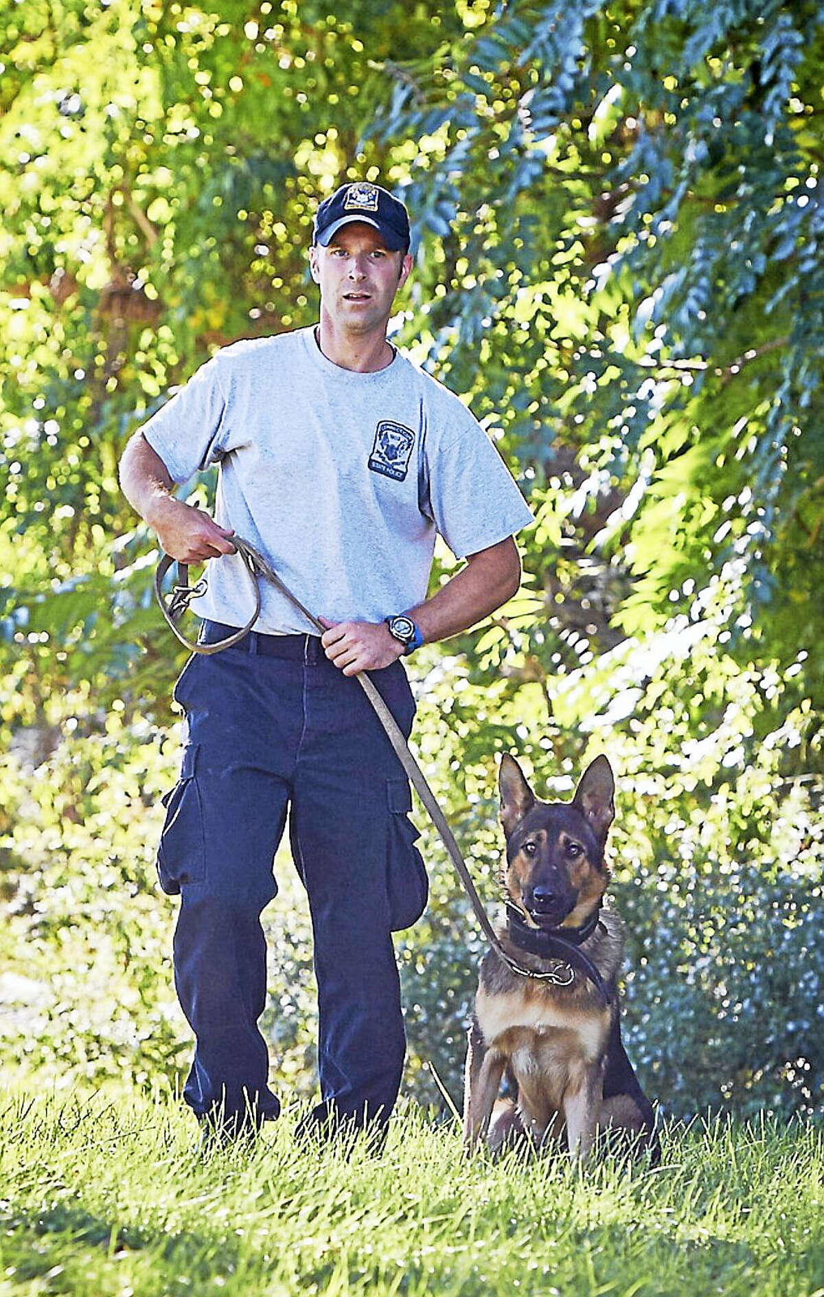 K-9 Tobi works with State Trooper Bruce LaChance.