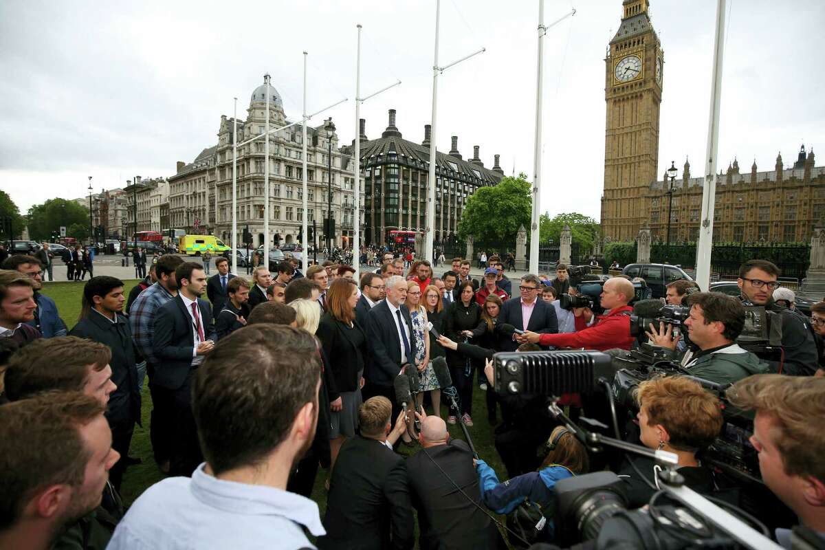 Labour Party leader Jeremy Corbyn, center, speaks to the media, Thursday June 16, 2016, during an impromptu vigil at Parliament Square opposite the Palace of Westminster, central London, following the death of Labour Member of Parliament, Jo Cox. The British lawmaker who campaigned for the country to stay in the European Union was killed Thursday by a gun- and knife-wielding attacker in her small-town constituency, a tragedy that brought the country’s fierce, divisive referendum campaign to a shocked standstill.