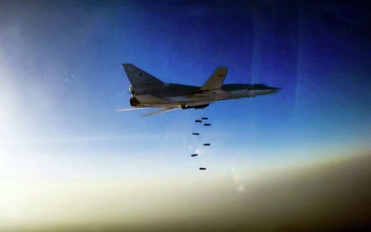In this frame grab provided by Russian Defence Ministry press service, Russian long range bomber Tu-22M3 flies during an air strike over Aleppo region of Syria on Aug. 16, 2016. Russia’s Defense Ministry said on Tuesday Russian warplanes have taken off from a base in Iran to target Islamic State fighters in Syria.