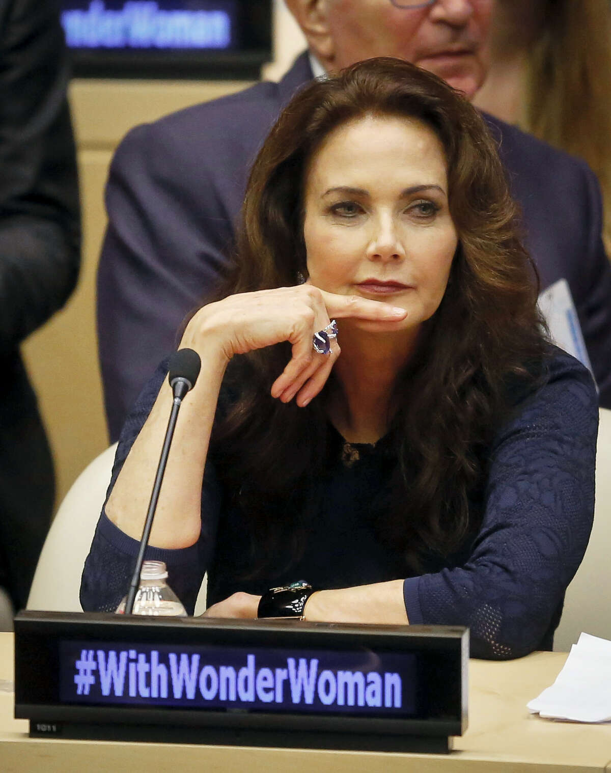 In this Oct. 21, 2016 photo, Lynda Carter, who played Wonder Woman on television, listens during a U.N. meeting to designate Wonder Woman as an “Honorary Ambassador for the Empowerment of Women and Girls,” at U.N. headquarters. Rhéal LeBlanc, the head of press and external relations, said Tuesday, Dec. 13, 2016 the appointment of Wonder Woman as an Honorary Ambassador for the Empowerment of Woman and Girls would end this week, a move that comes less than two months after a splashy ceremony at the U.N.