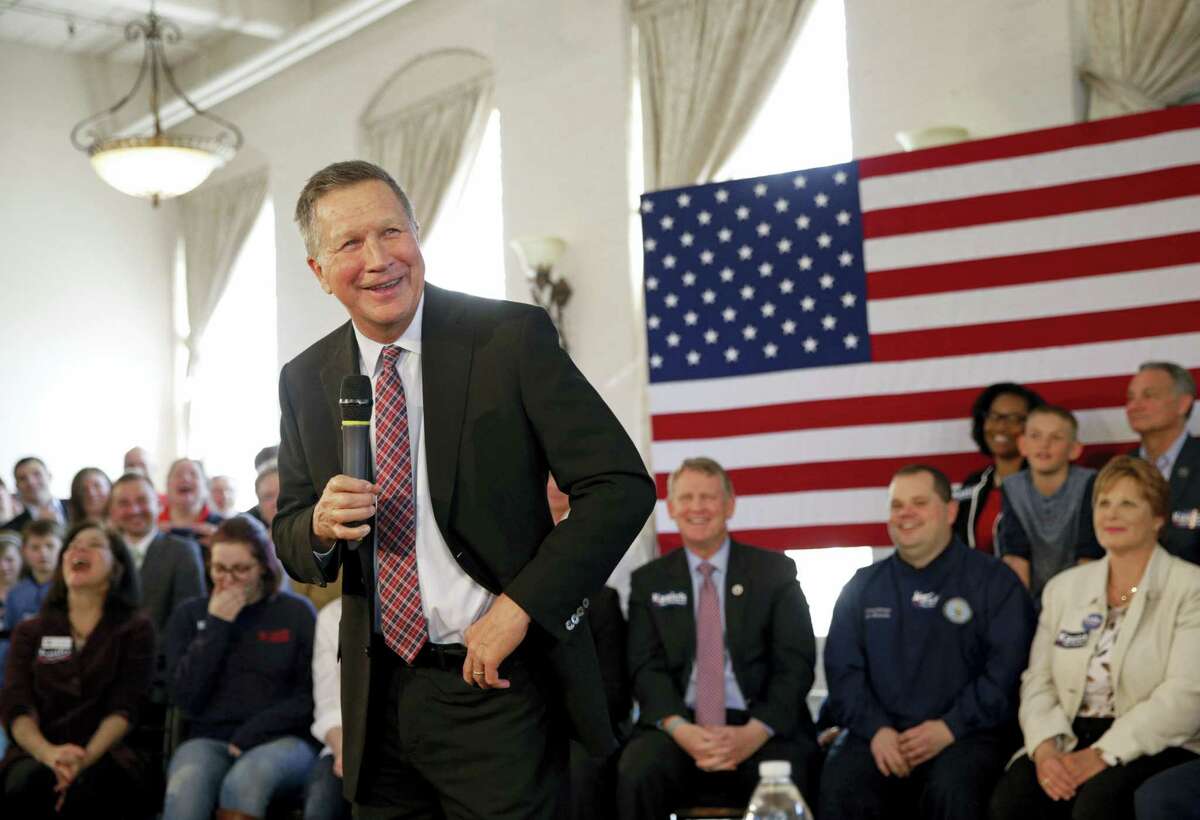 Republican presidential candidate Ohio Gov. John Kasich laughs during a town hall at Savage Mill in Savage, Md., Wednesday.