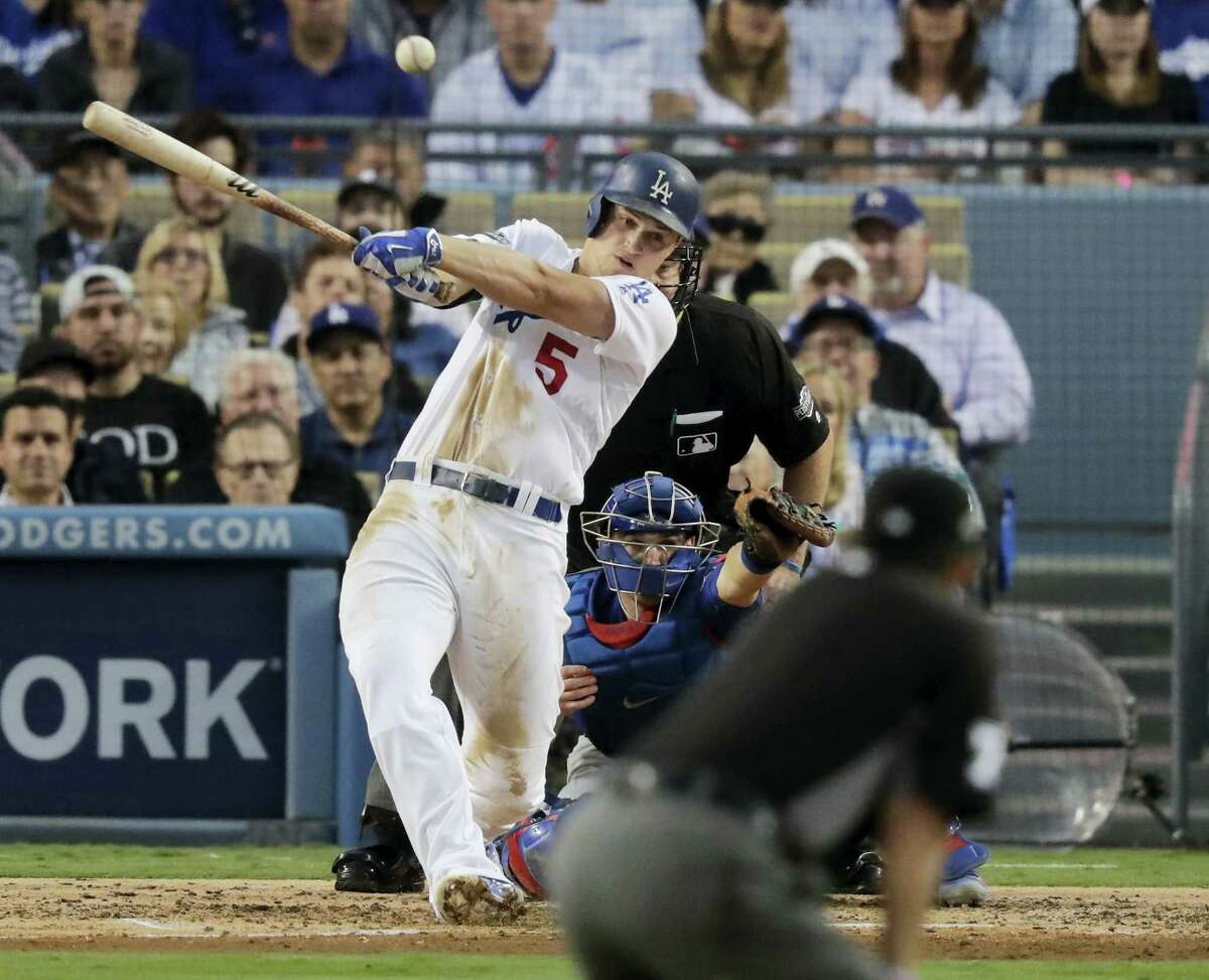 The Dodgers’ Corey Seager hits an RBI single during the third inning on Tuesday.