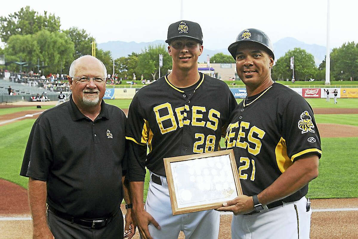 Photo courtesy of Salt Lake Bees Troy Scribner, center, is presented the PCL pitcher of the week award by Salt Lake Bees general manager Marc Amicone, left, and manager Keith Johnson.