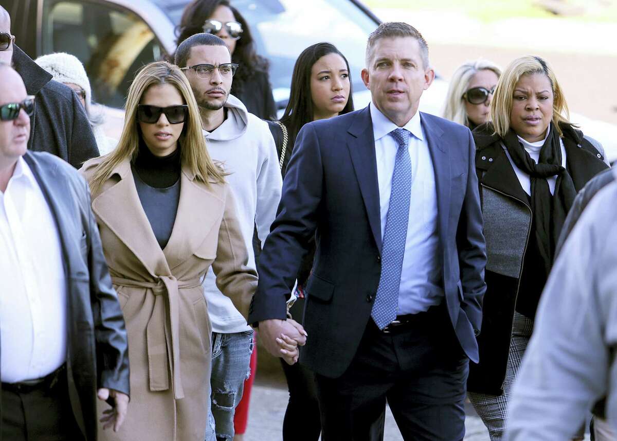 New Orleans Saints head coach Sean Payton walks with Will Smith’s widow Racquel into Orleans Criminal Court for the trial of Cardell Hayes on Dec. 10, 2016 in New Orleans. Hayes killed Will Smith in a road rage incident, in which Smith’s wife was also shot and wounded.