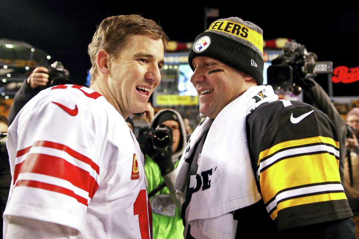 Steelers quarterback Ben Roethlisberger, right, and Giants quarterback Eli Manning visit after their game on Dec. 4.