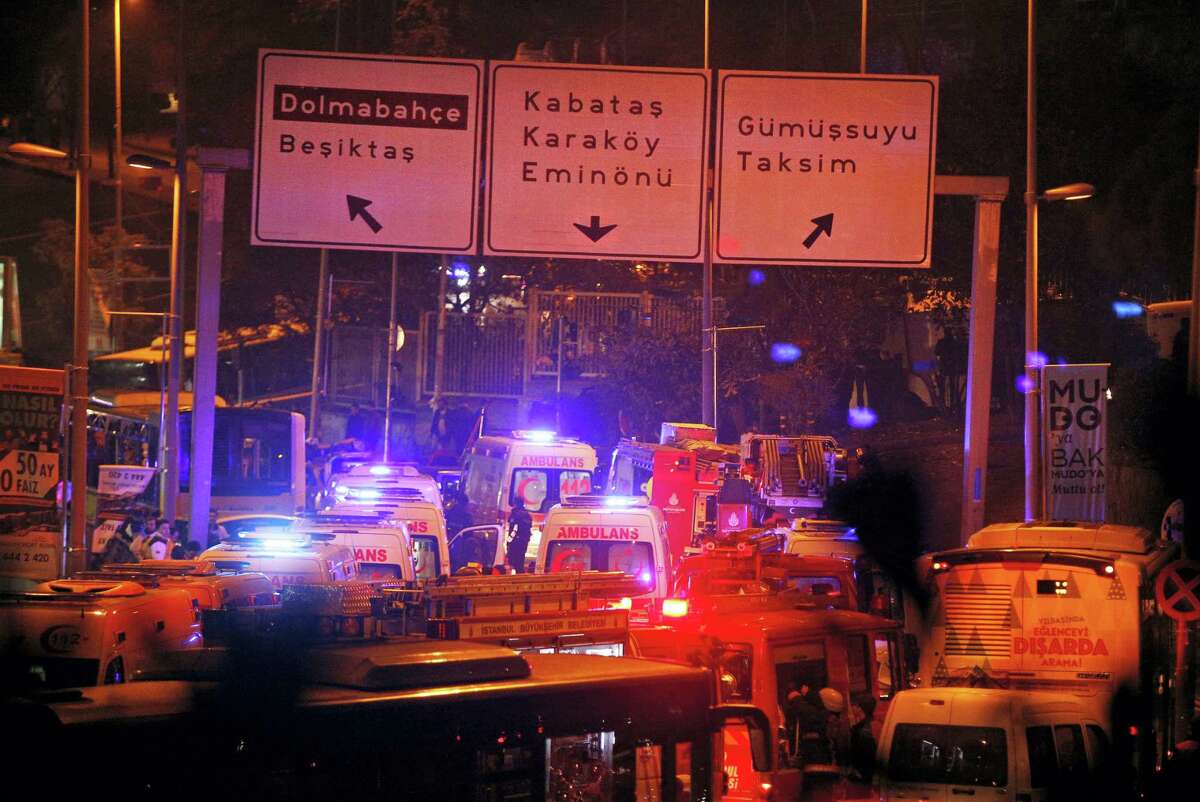 Rescue services rush to the scene of explosions near the Besiktas football club stadium, following at attack in Istanbul, late Saturday, Dec. 10, 2016. Two loud explosions have been heard near the newly built soccer stadium and witnesses at the scene said gunfire could be heard in what appeared to have been an armed attack on police. Turkish authorities have banned distribution of images relating to the Istanbul explosions within Turkey.