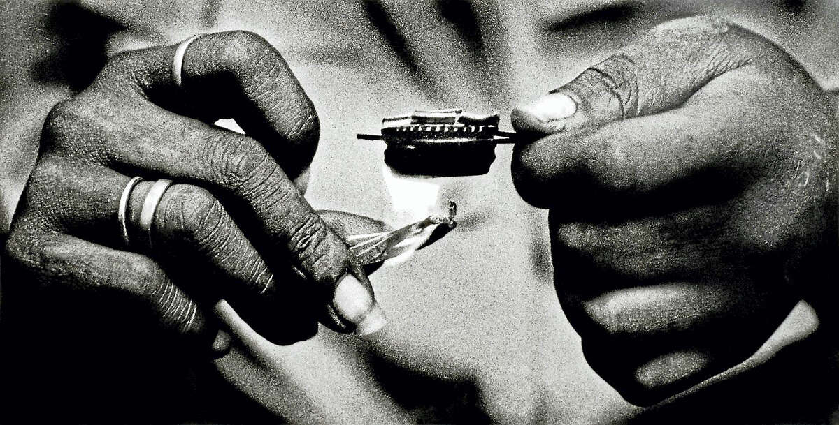 (Photograph by Peter Hvizdak - New Haven Register) NEW HAVEN: Cooking heroin and cocaine, a.k.a. cooking a speedball, to be injected into a heroin addict's veins.