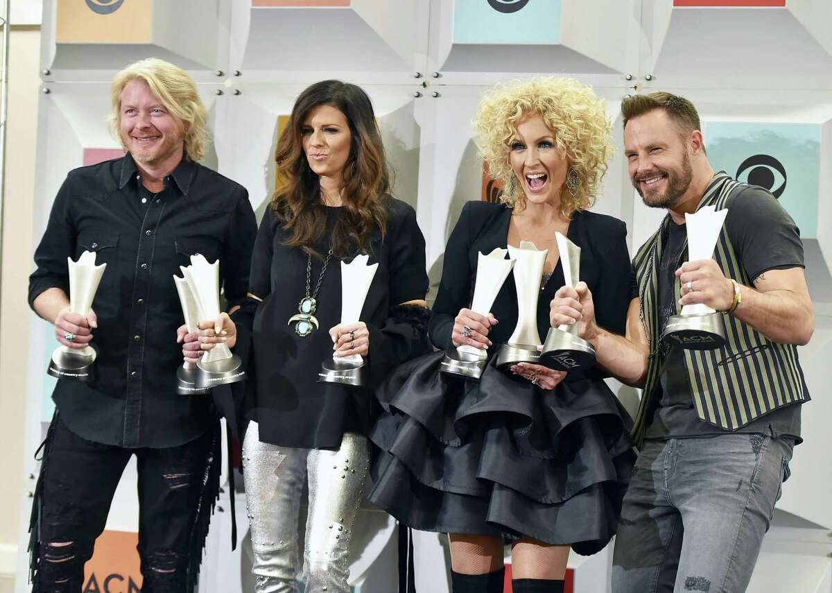 Little Big Town, winner of the award for vocal group of the year, and vocal event of the year for Smoking' And Drinkin', pose in the press room at the 51st annual Academy of Country Music Awards at the MGM Grand Garden Arena on Sunday, April 3, 2016, in Las Vegas. Pictured from left are Phillip Sweet, Karen Fairchild, Kimberly Schlapman and Jimi Westbrook. (Photo by Jordan Strauss/Invision/AP)