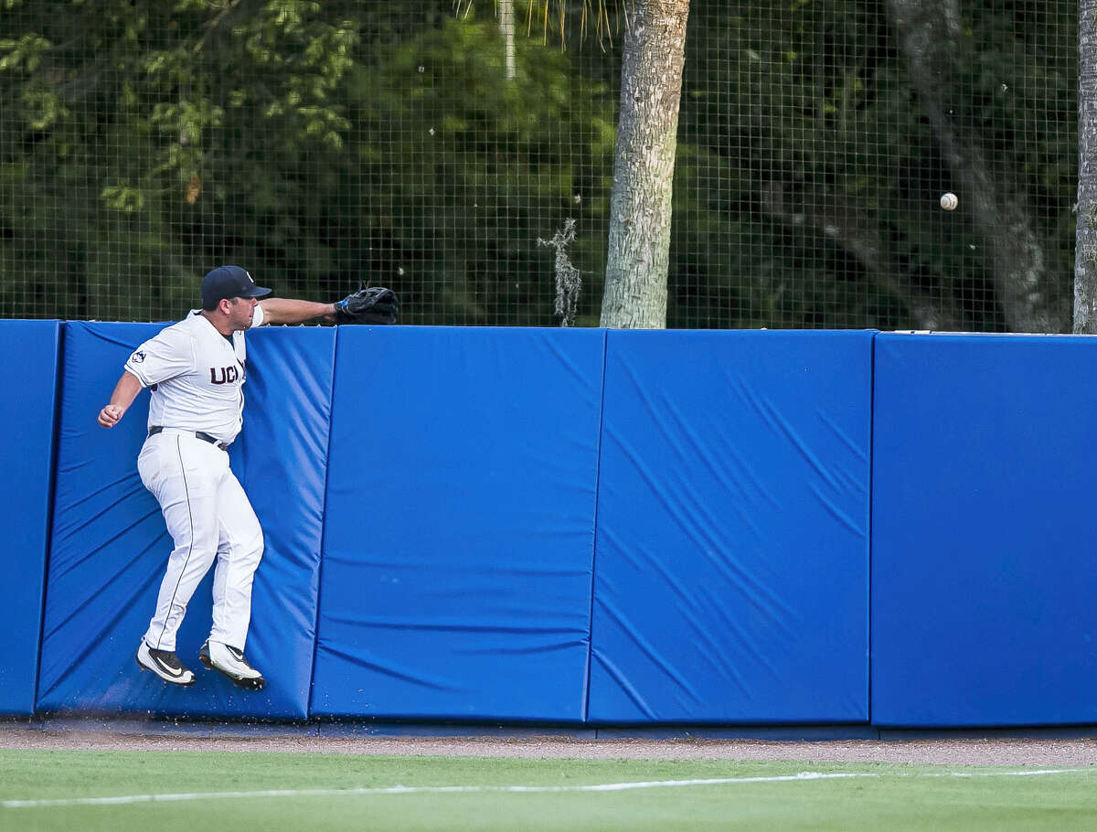 UConn’s Joe DeRoche-Duffin cannot snag Florida’s Danny Reyes’s home run during Saturday’s game.