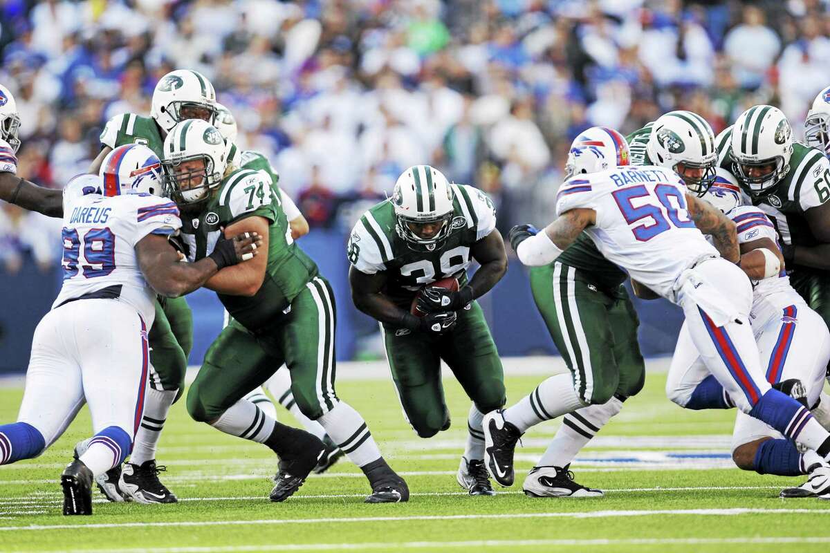 New York Jets fullback John Conner (38) runs against the Buffalo Bills during a 2011 game in Orchard Park, N.Y.