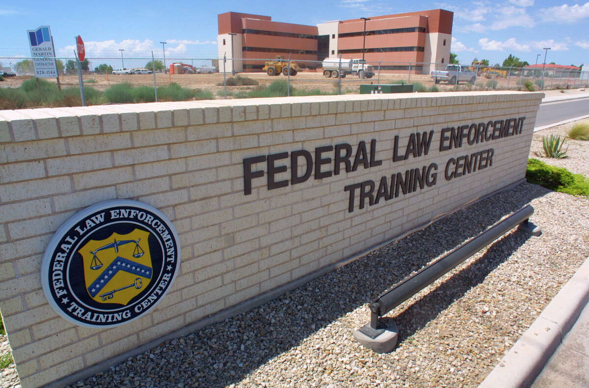 FILE - In this Aug. 1, 2002 file photo, a sign outside the Federal Law Enforcement Training Center in Artesia, N.M. The Homeland Security Department has privately acknowledged that a remarkable number of young families caught crossing the border illegally earlier this year subsequently failed to meet with federal immigration agents, as they were instructed. At the meeting, the ICE official acknowledged the no-show figures while explaining the administrationís decision in June to open a temporary detention center for families in Artesia, New Mexico. A second immigration jail in Texas was later converted for families and can house about 530 people. A third such detention center will open in Texas later this year. Before the new facility in Artesia, the government had room for fewer than 100 people at its only family detention center in Pennsylvania.