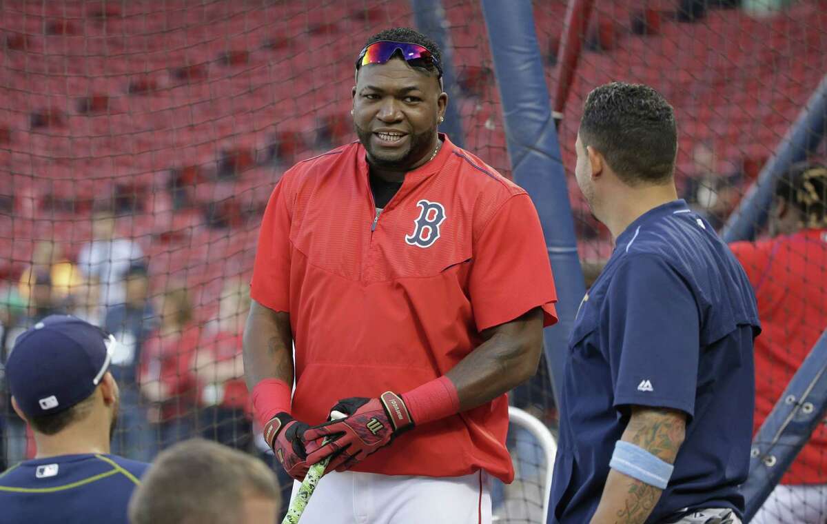 Boston Red Sox DH David Ortiz, center, speaks with members of the Tampa Bay Rays, including Asdrubal Cabrera, right, before Monday’s game at Fenway Park.