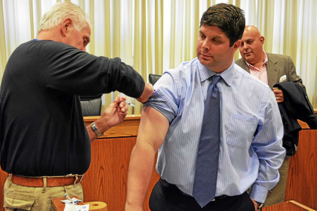 Middletown Mayor Dan Drew gets his annual flu shot at city hall Tuesday. Clinics begin soon.