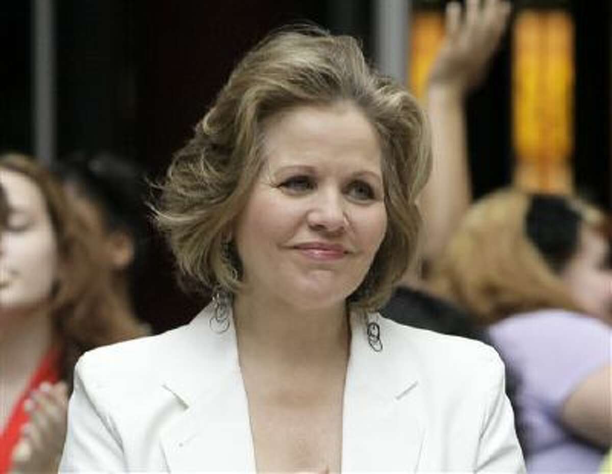 This March 19, 2012 file photo shows opera singer Renee Fleming in the rotunda of the State of Illinois building, the James R. Thompson Center, in Chicago. Fleming, a four-time Grammy winner, will perform sing the national anthem before the Denver Broncos take on the Seattle Seahawks at MetLife Stadium in East Rutherford, N.J. on Feb 2.